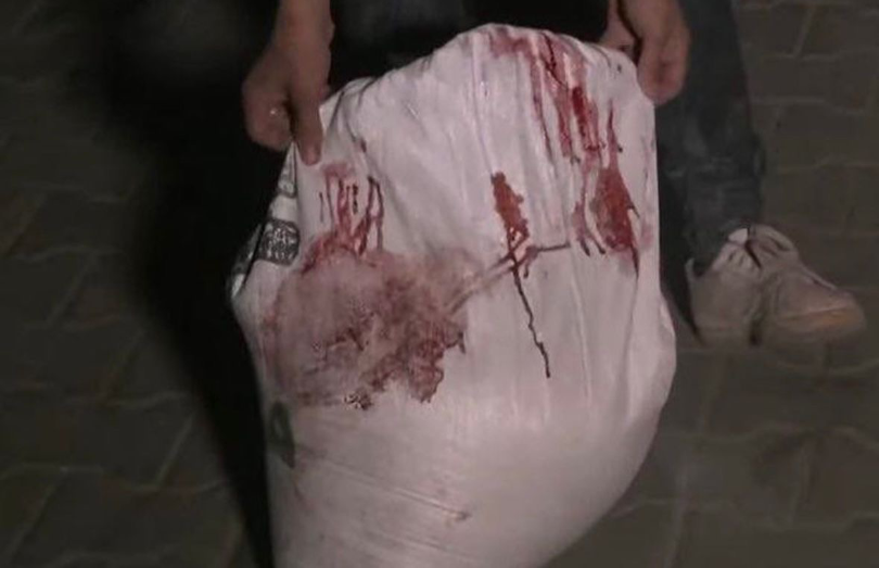 Bloody food supplies after Israeli helicopter attack on March 14.