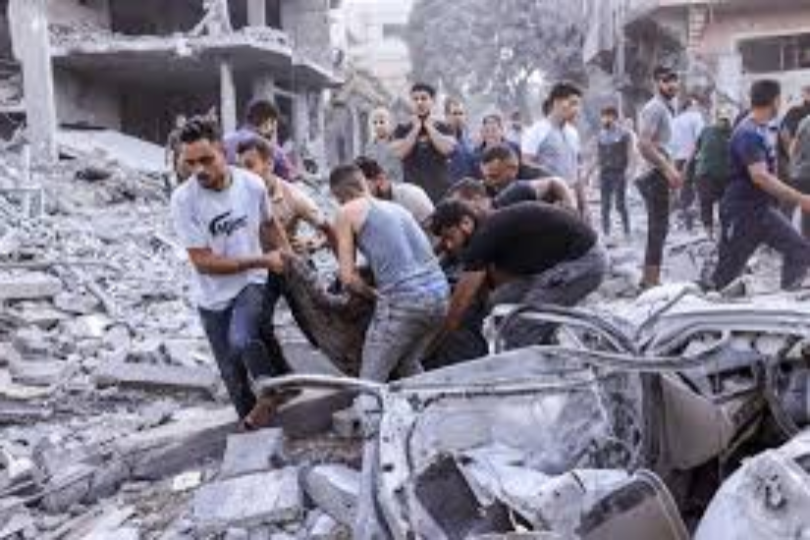 Palestinians attempt to carry out wounded and dead after IDF attacks during humanitarian aid arrival on February 29, 2024.