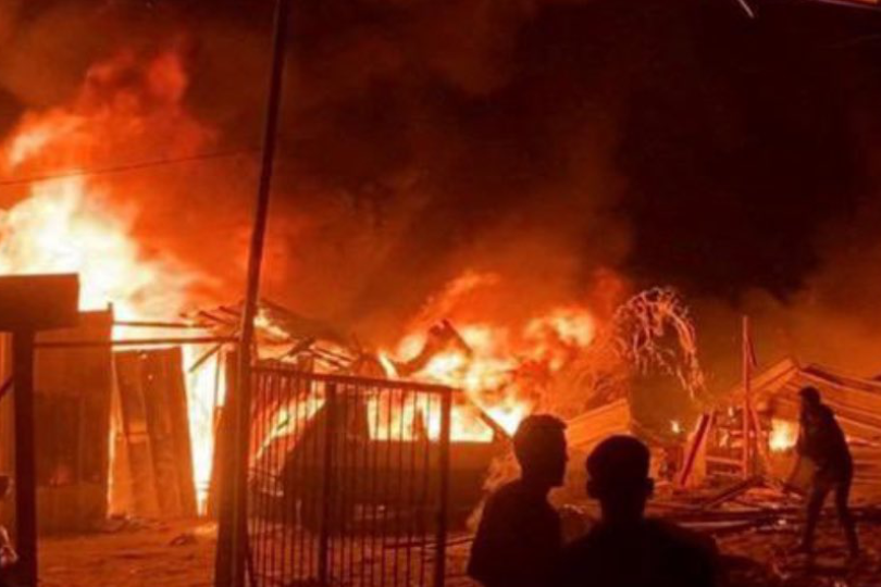 The Tel al-Sultan refugee camp in Rafah burns after shelling by IDF forces on May 26, 2024.